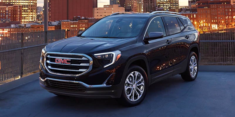 A GMC Terrain parked, with a building visible in the background.