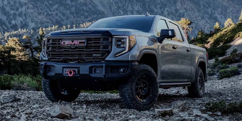 GMC Sierra 1500 on a mountain with scenic views.