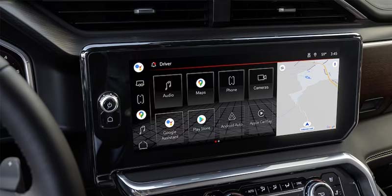 The touchscreen display in a GMC Sierra 1500, showcasing the infotainment system and controls.